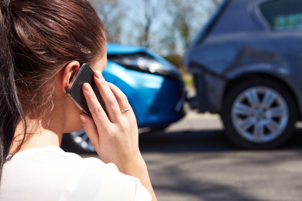 Female Driver Making Phone Call After Traffic Accident 456512005 1255x837